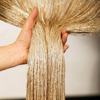 Goldener Türvorhang mit Perlenfaden