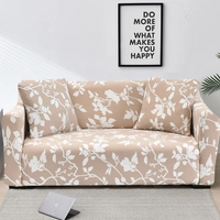 Housse Canapé avec Imprimé Floral en Polyester sur fond gris avec un tableau et un ordinateur portable au sol