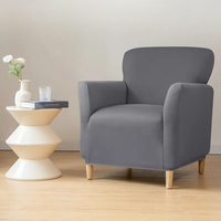 Housse Fauteuil Universelle Extensible de Style Moderne en Polyester sur fond beige avec une table et des fleurs