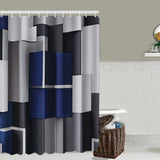 Rideau de Douche 3D Moderne et Imperméable avec Formes Géométriques sur une douche sur fond gris avec un panier au sol à droite