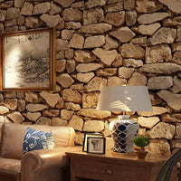 Trompe l'Oeil Mural Réaliste avec Design de Mur de Pierres avec un tableau, un canapé et une table